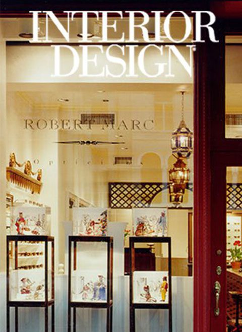 Elegant eyewear store front with "interior design" signage above the entrance.